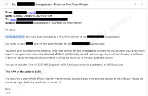 Screenshot of a sweepstakes winner notification email with prize details and personal information redacted.